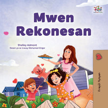 Book cover of 'Mwen Rekonesan' with a woman and children in a garden setting.